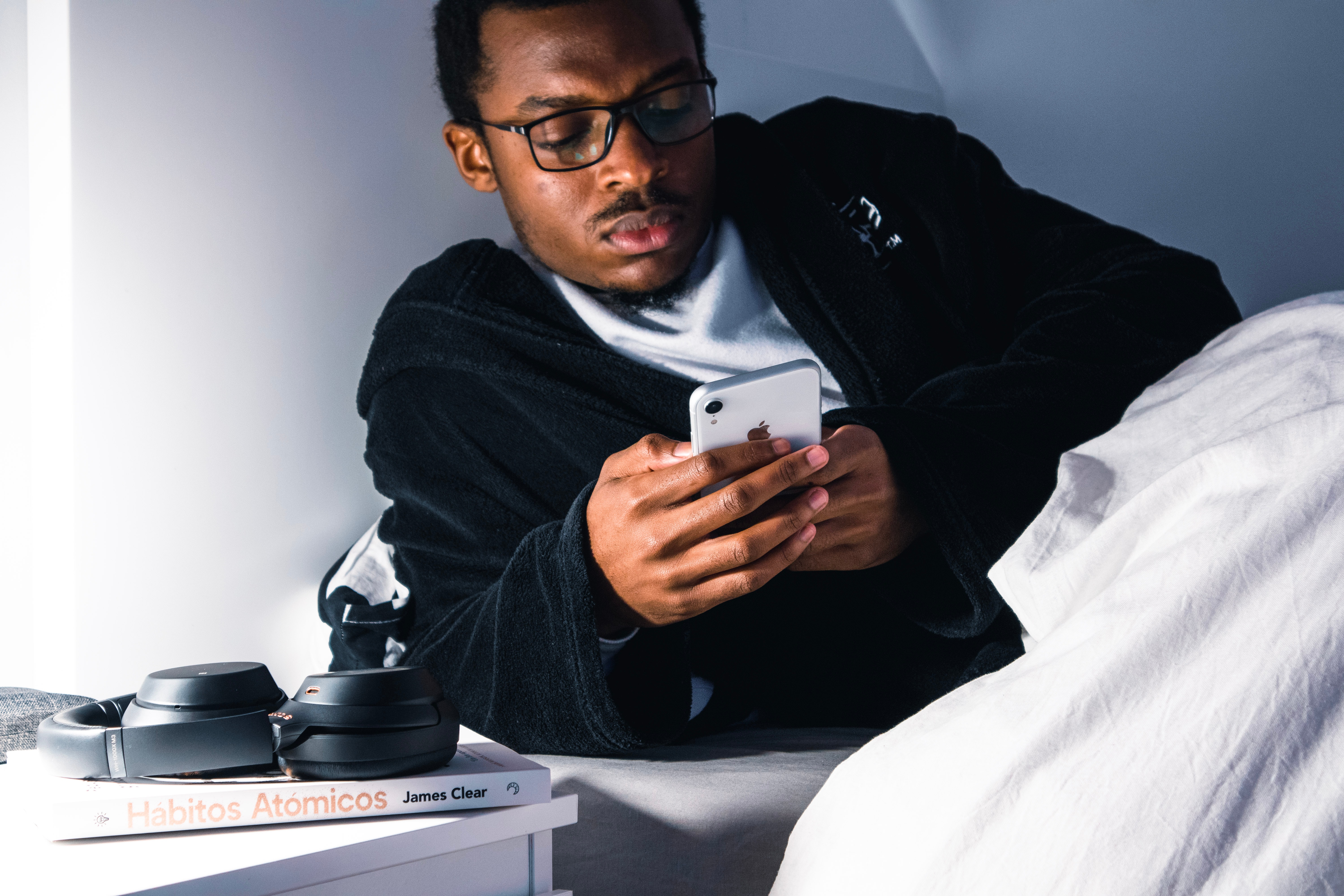 Man in bed on phone