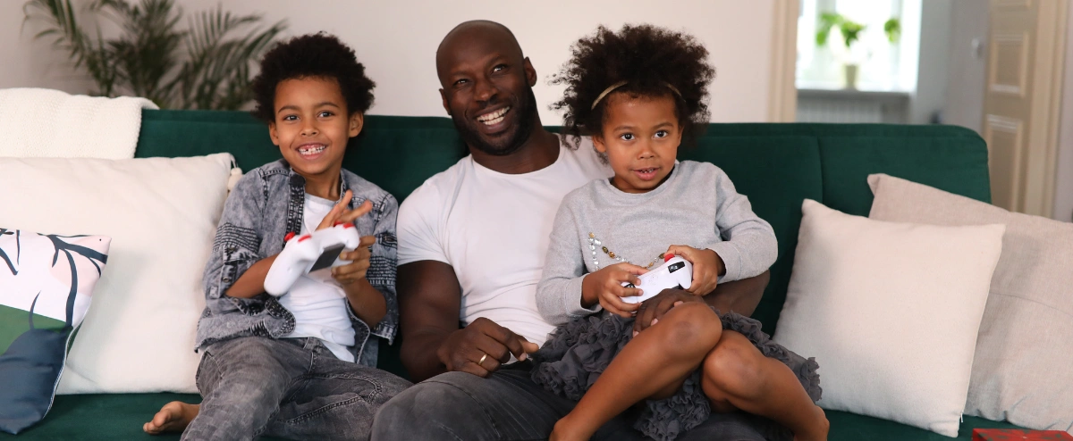 Son and father playing video games.
