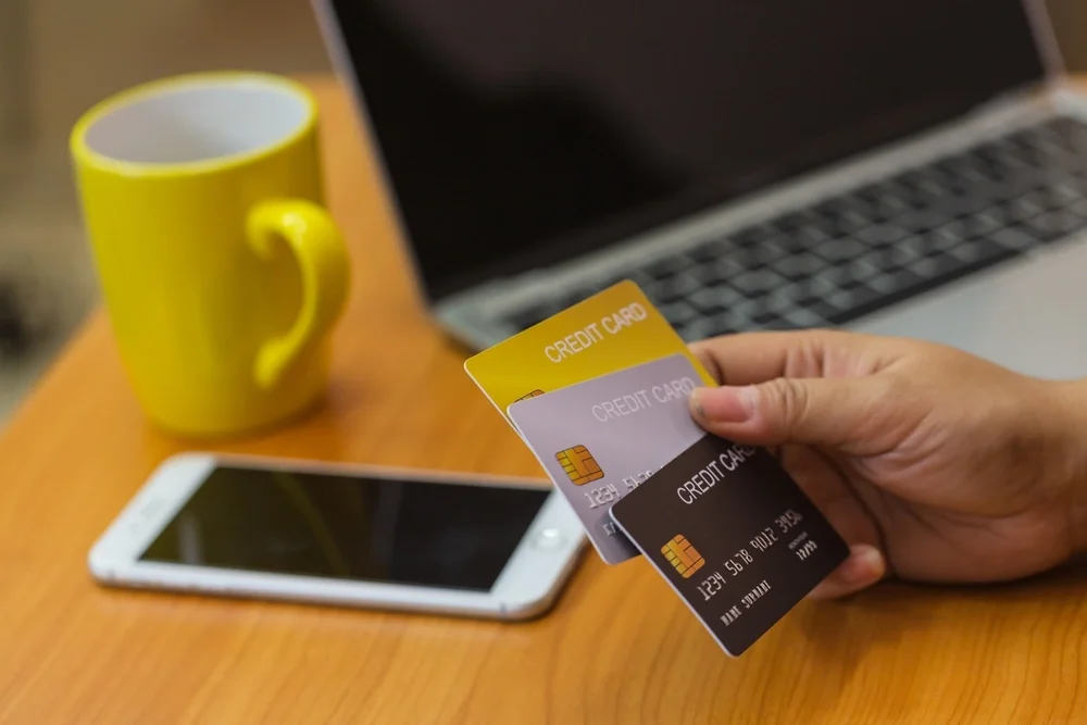 Close up of someone holding multiple credit cards