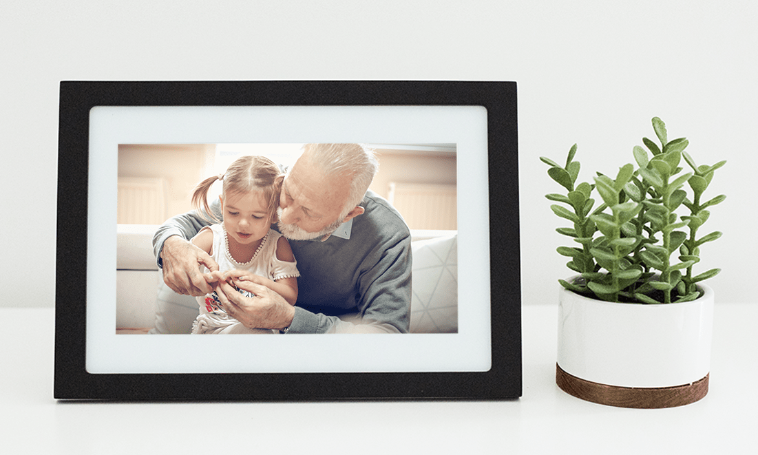 Grandpa and granddaughter on digital photo frame