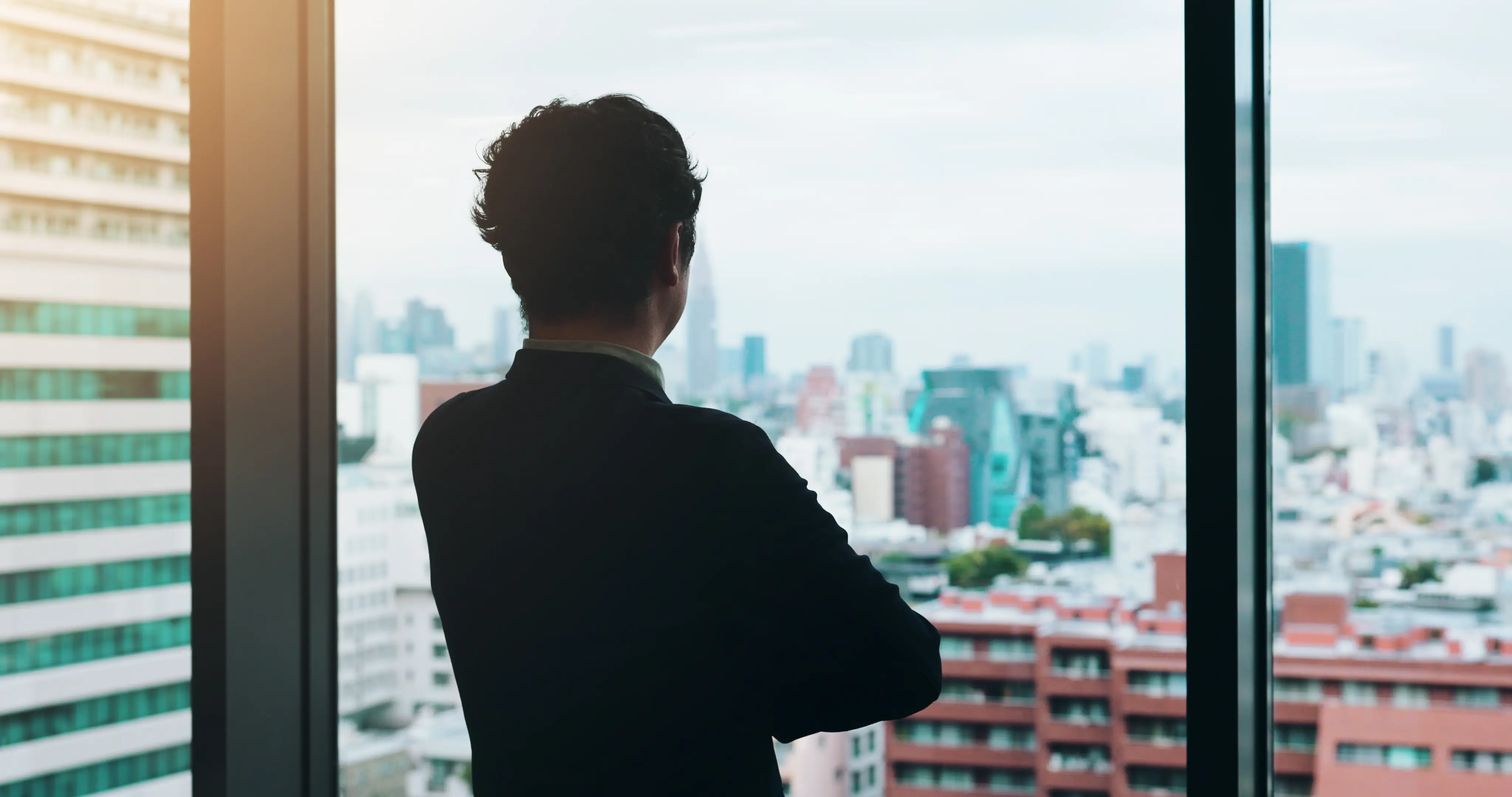 Professional reflecting near office window