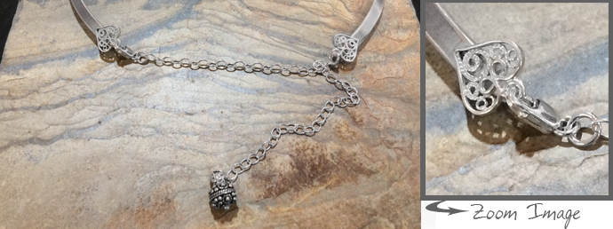 collar with filigree heart finishing details