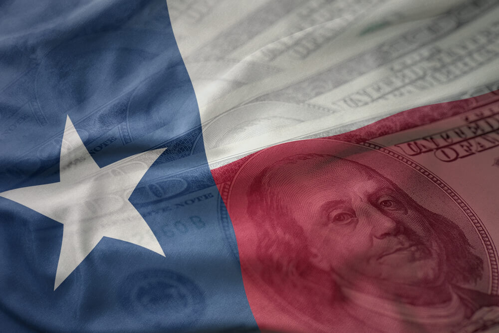 Texas flag with money in the background