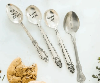 4 spoons stamped with puns such as "Get well spoon".