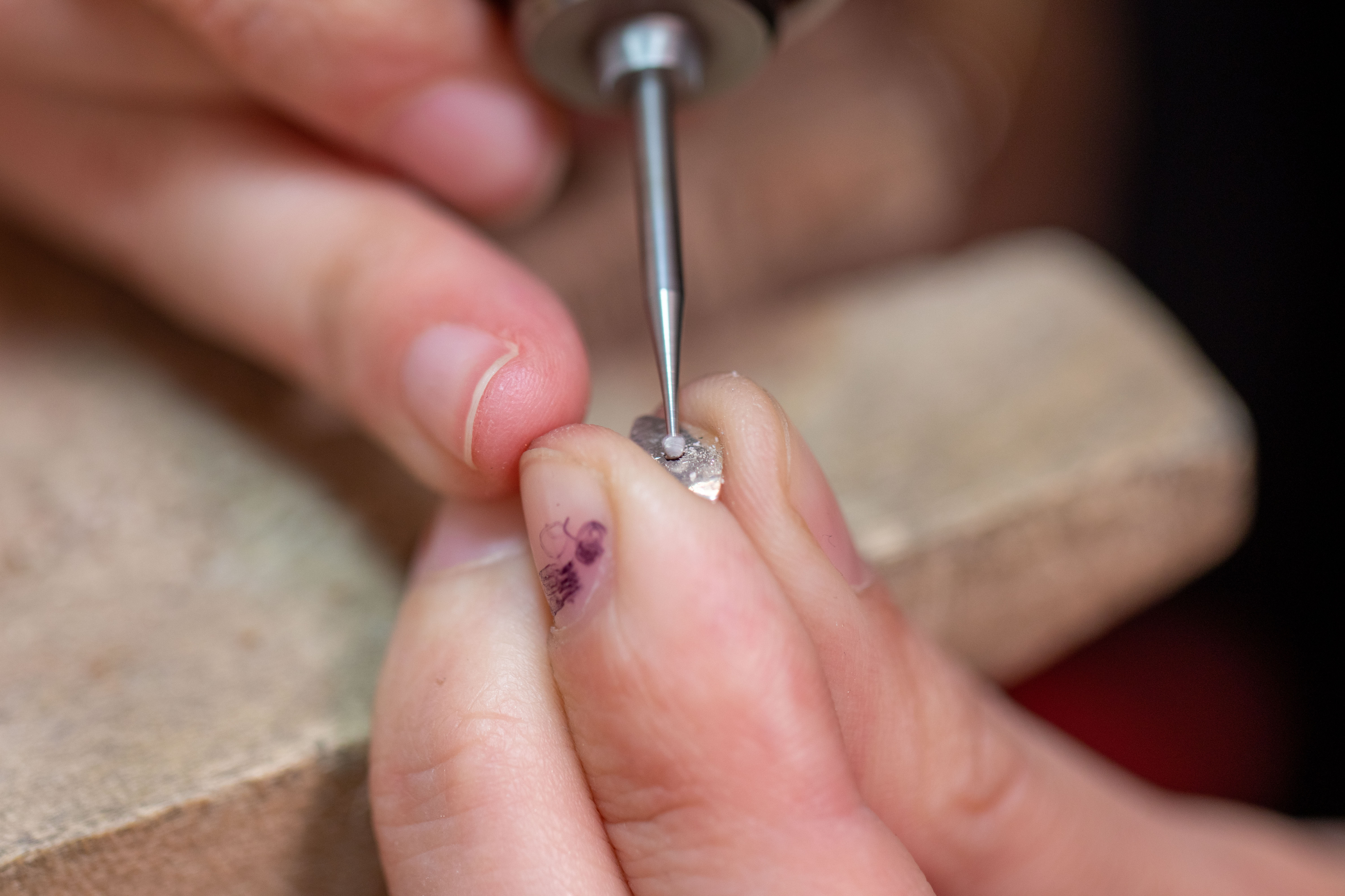 Ball bur making a small divot on a small piece of silver