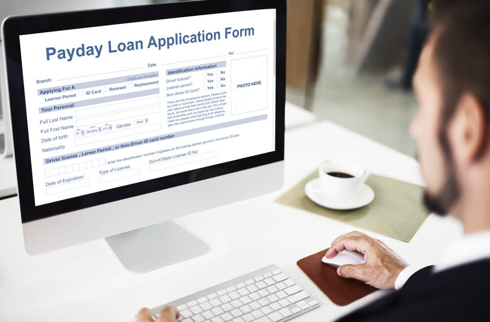 man applying for a payday loan online