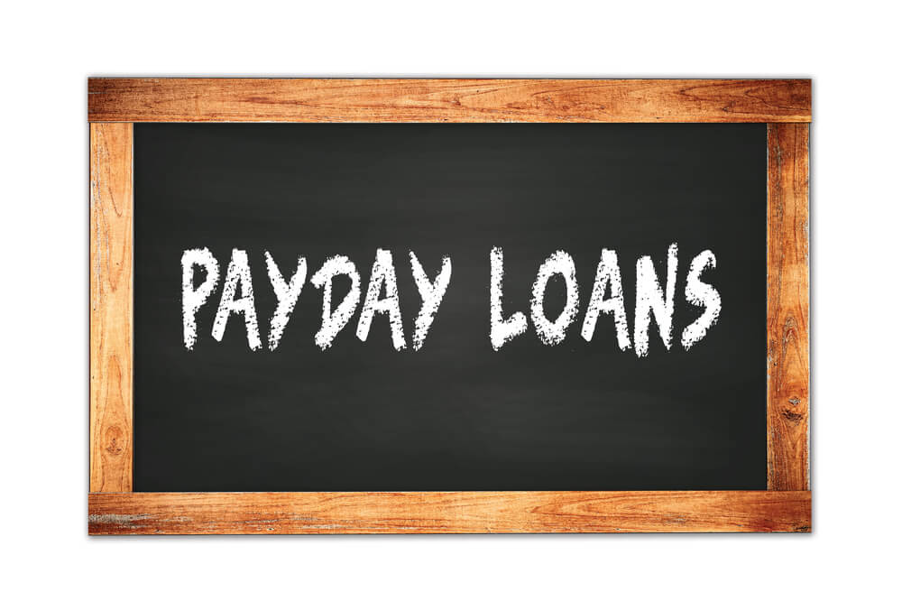 payday loans written on a blackboard
