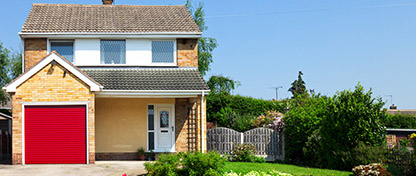 Image of a house with driveway and garden