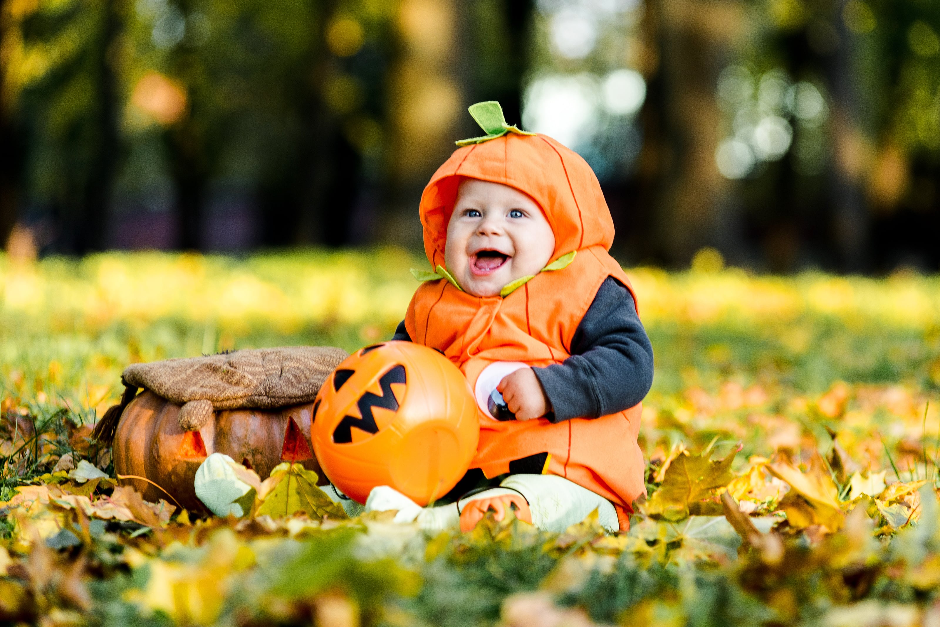 Baby in pumpkin costume for Halloween