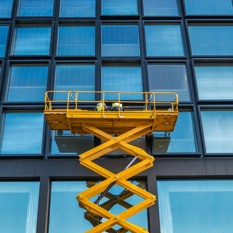 Window Cleaners Working on a Scissor Lift