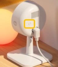 A white device with a round white cordAI-generated content may be incorrect.