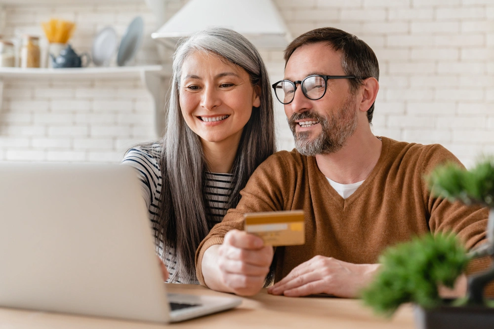 Couple looking at a laptop