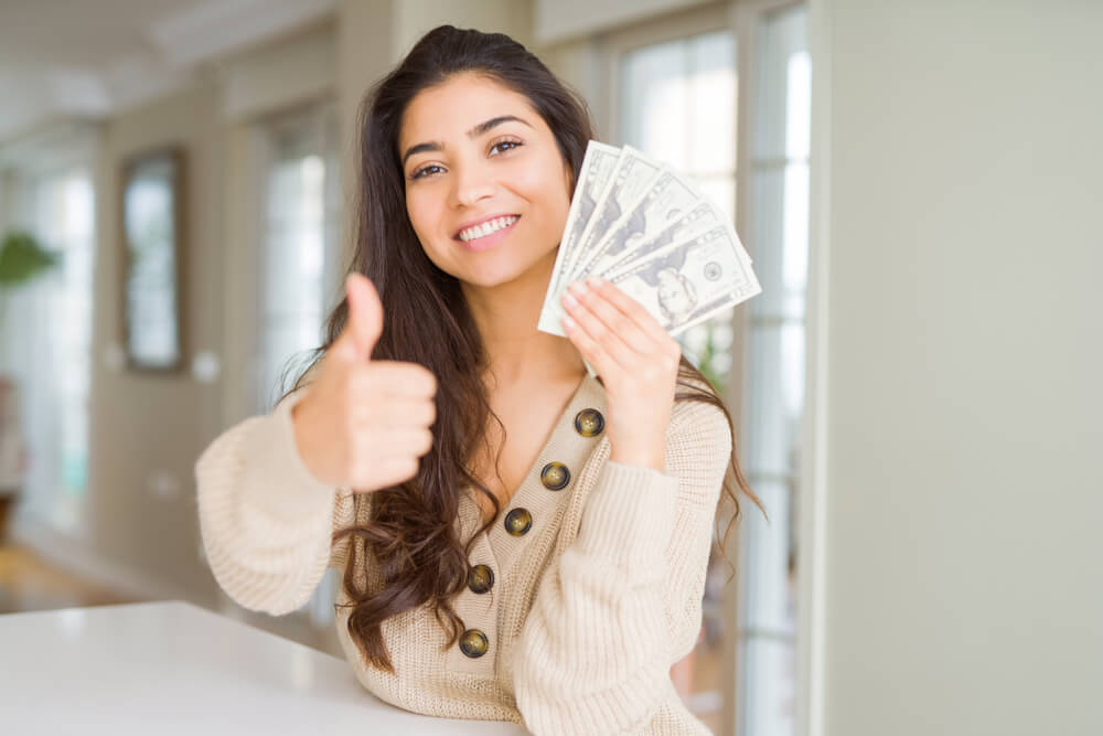 woman with payday loan cash