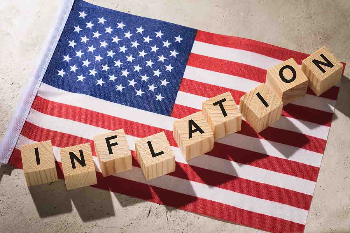 U.S. Flag with inflation spelled out with wooden blocks