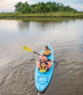 People kayaking in the Mobile-Tensaw Delta, AL