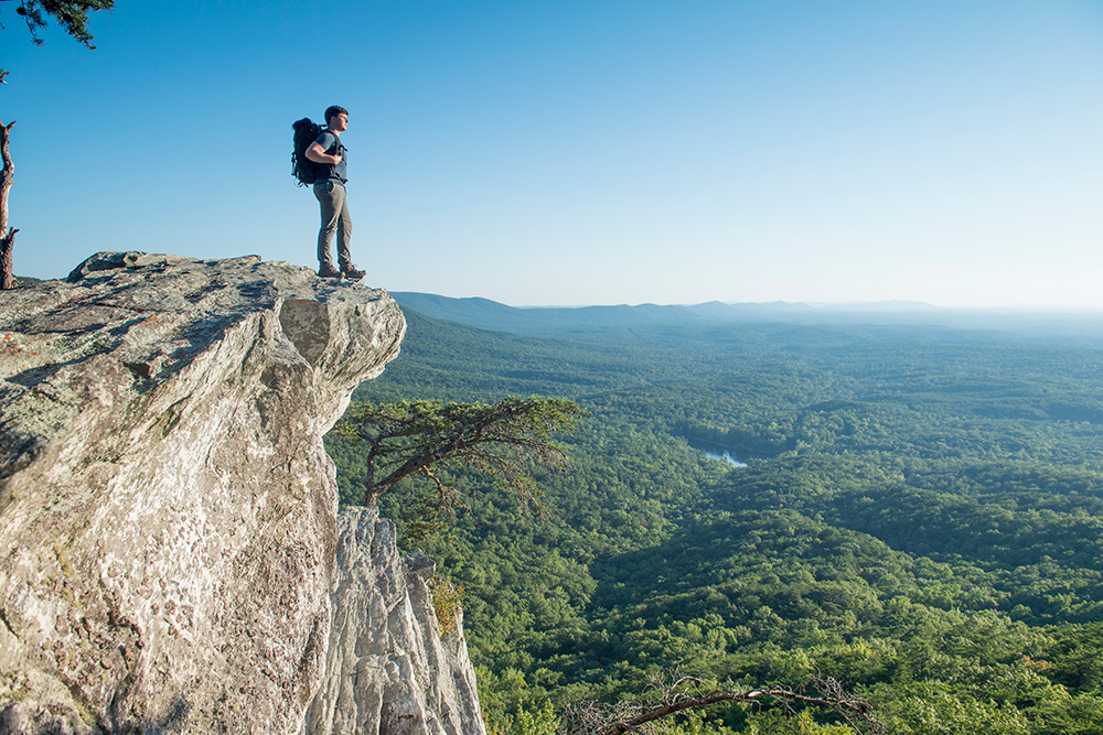 Person standing on Mount Cheaha