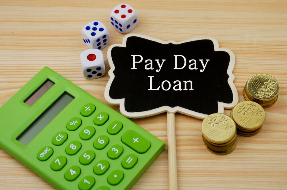 pay day loan sign with calculator