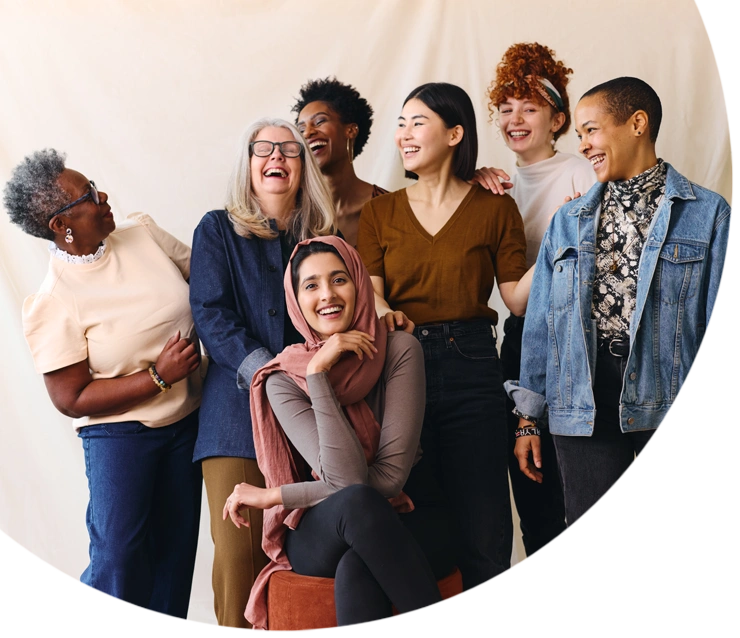 Portrait of cheerful mixed age range multi ethnic women celebrating International Women's Day