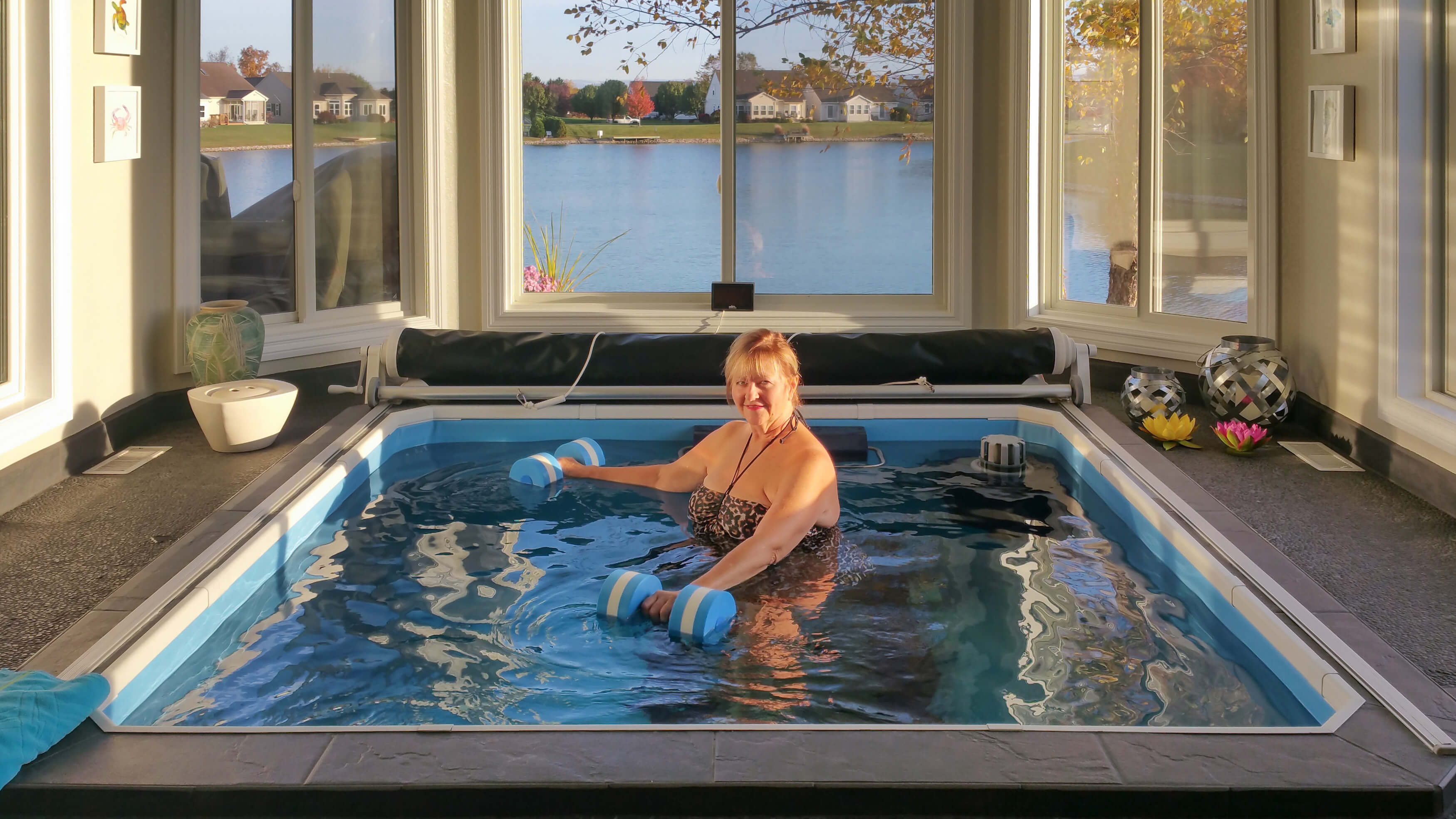 a senior exercising in her Endless Pools WaterWell therapy pool