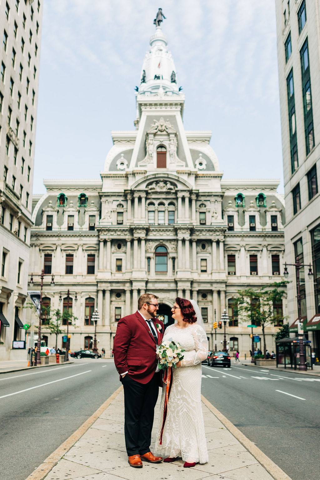 couple in front of city call in philly