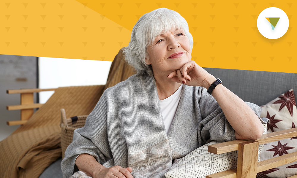 Older woman sitting in chair.
