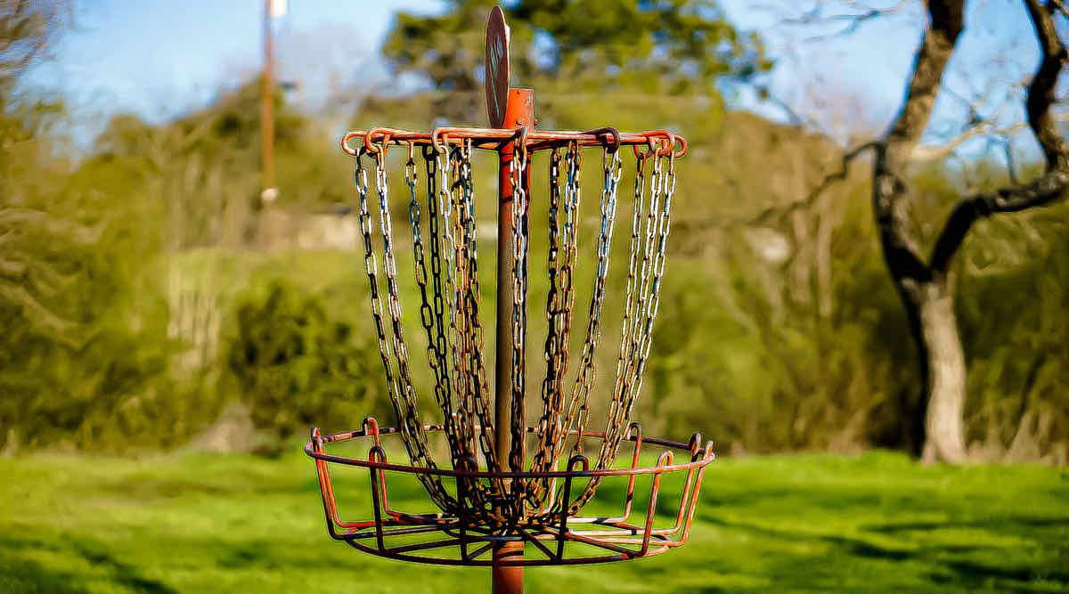 Close-up of an old and well-used disc golf basket.