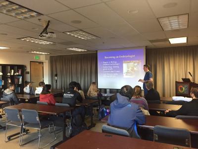 Dr. Joe Conaghan presents a powerpoint presentation to students at the department of biology at the University of San Francisco