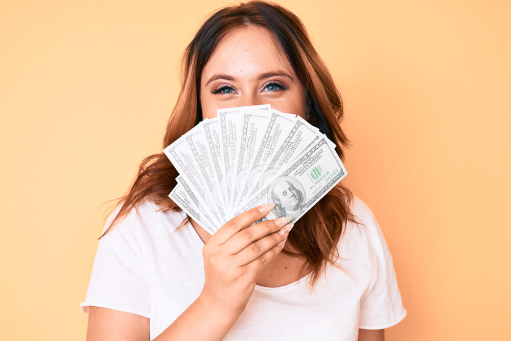woman with payday advance loan money