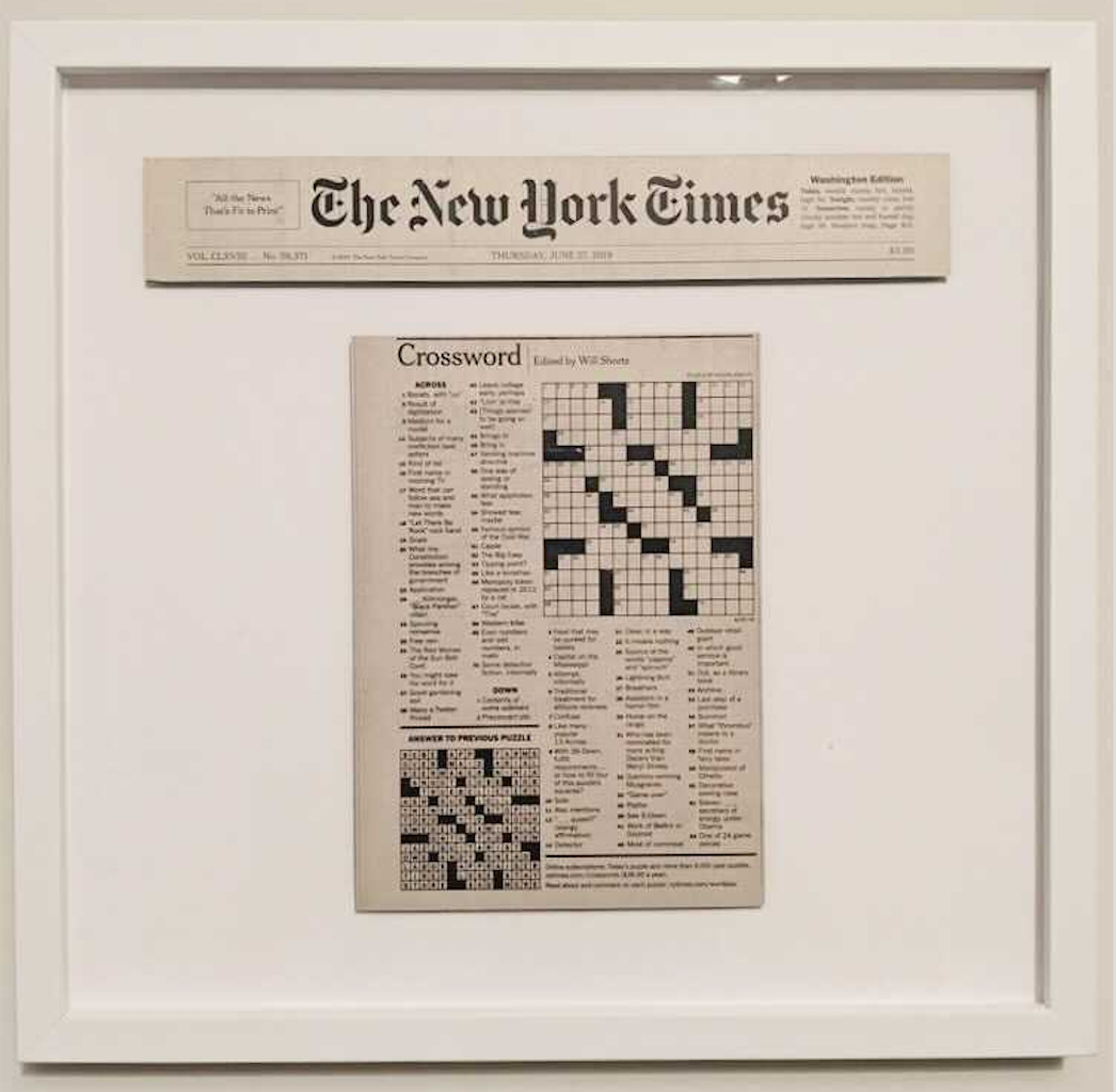 framed blank New York Times crossword puzzle in white frame