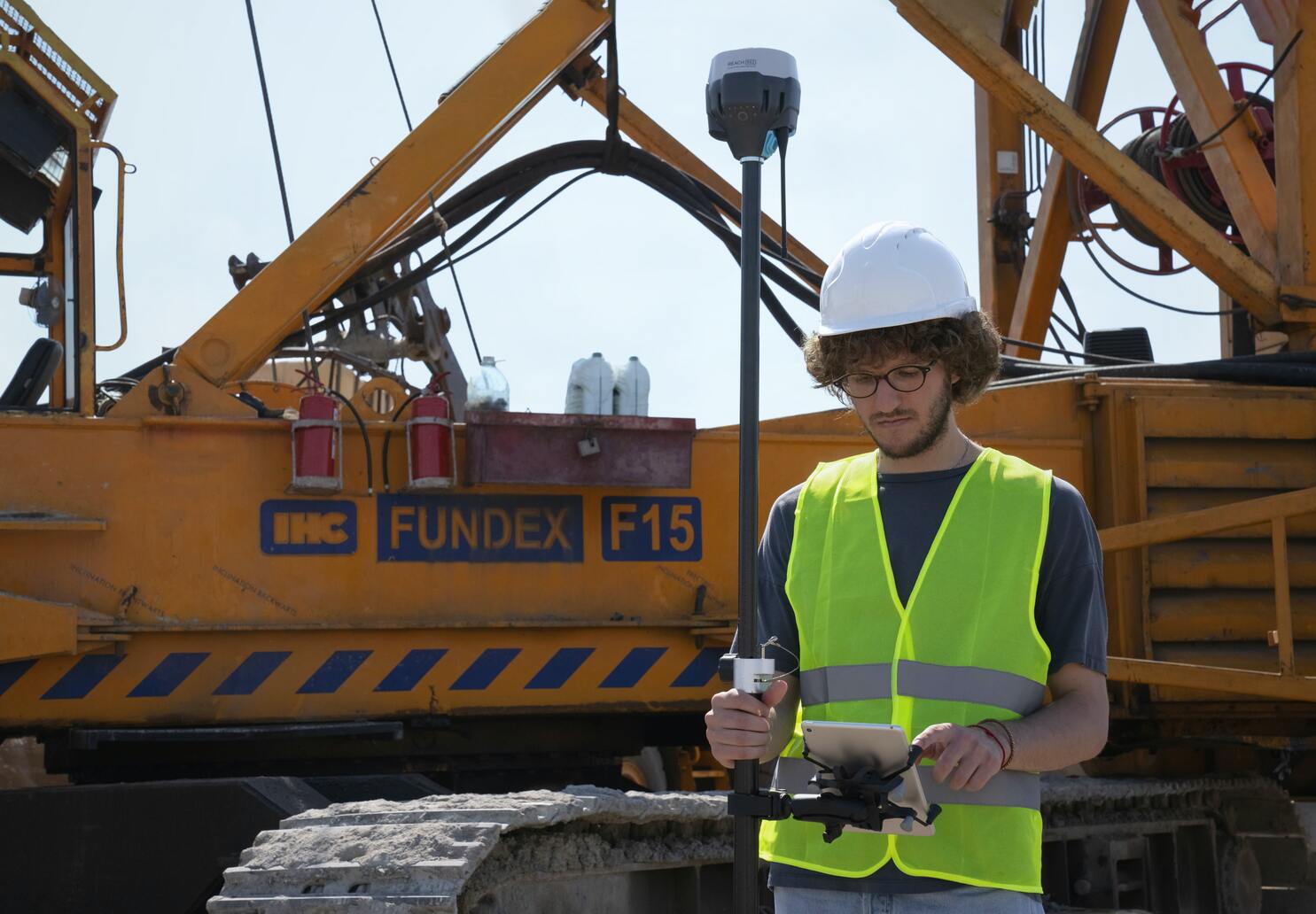 Engineer standing in front of a tractor