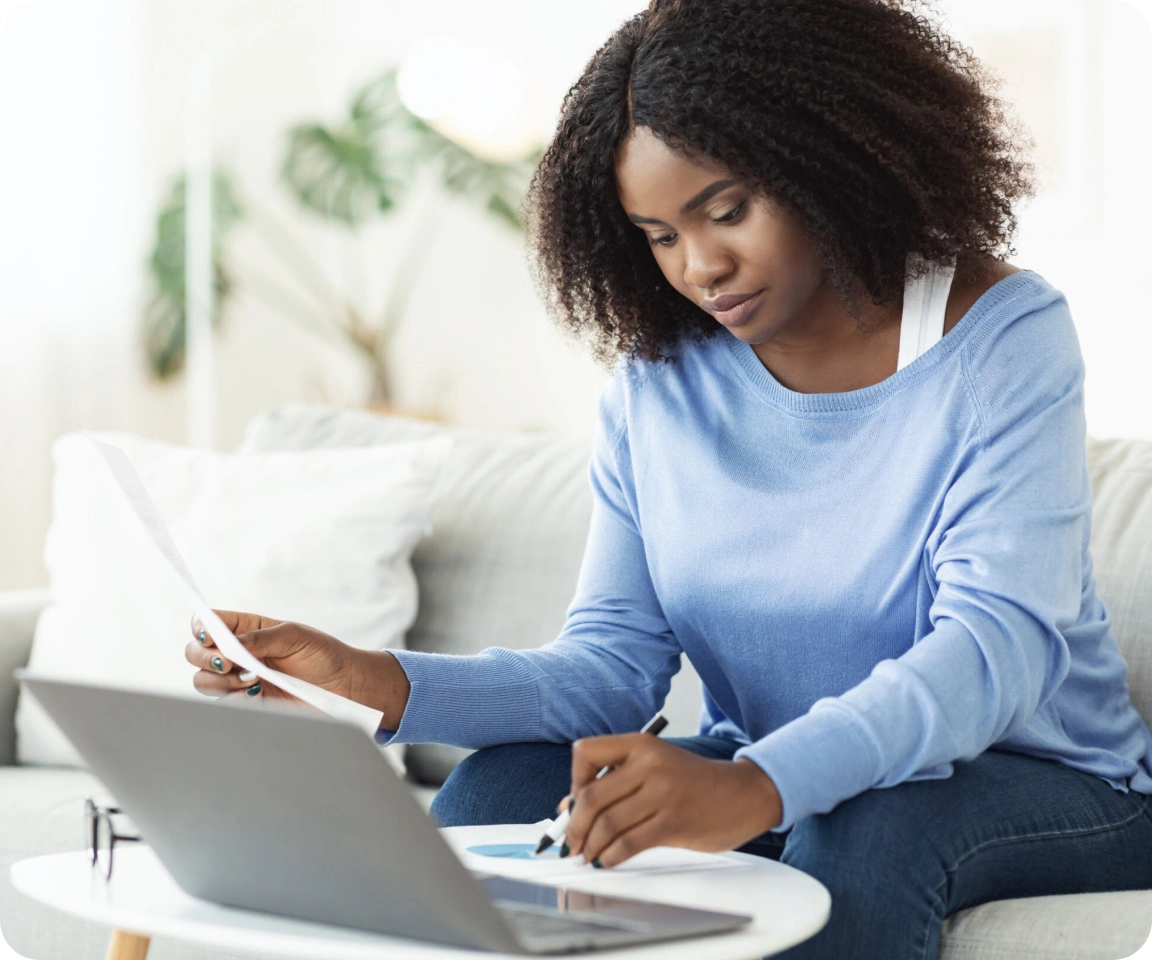A  woman working at laptop
