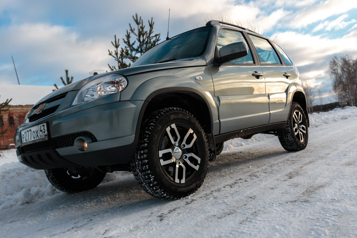 suv on snowy road for winter tires.webp