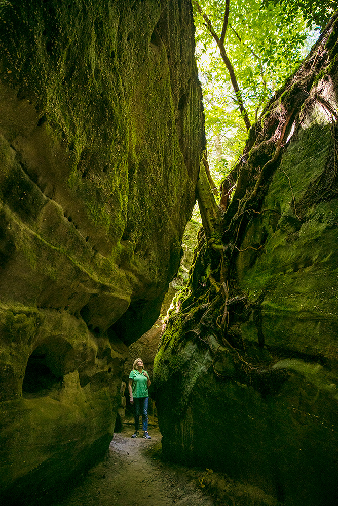 Person exploring the Dismals Canyon