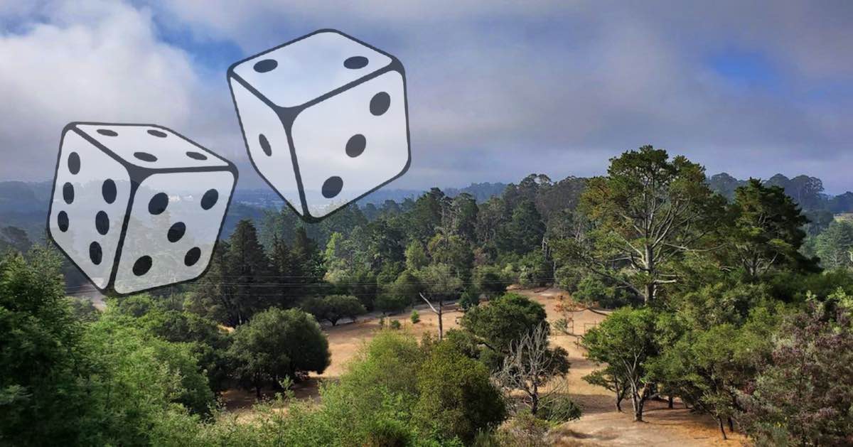 A large pair of dice super-imposed over a park filled with trees as seen from a high vantage point