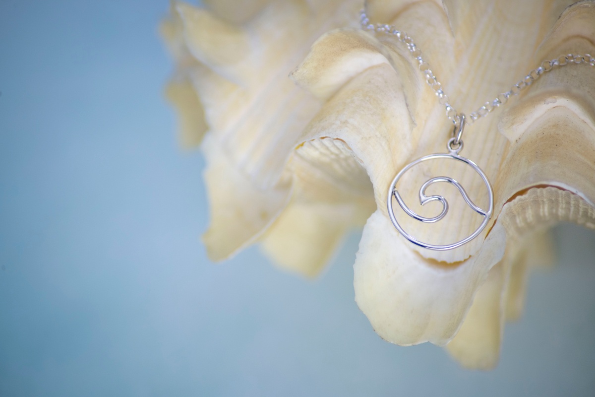 Temperature & Tint corrected image of wave charm on seashell
