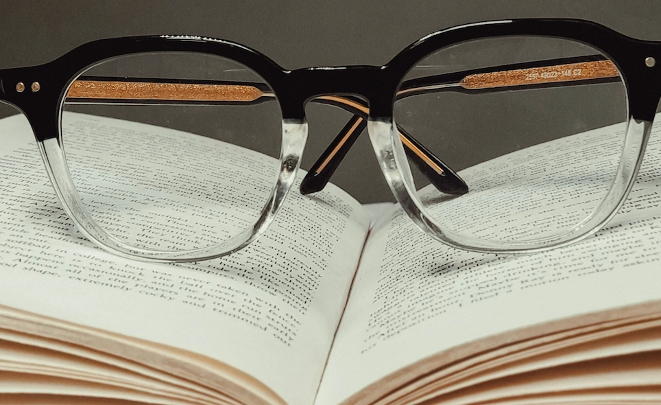 Glasses sitting on a book