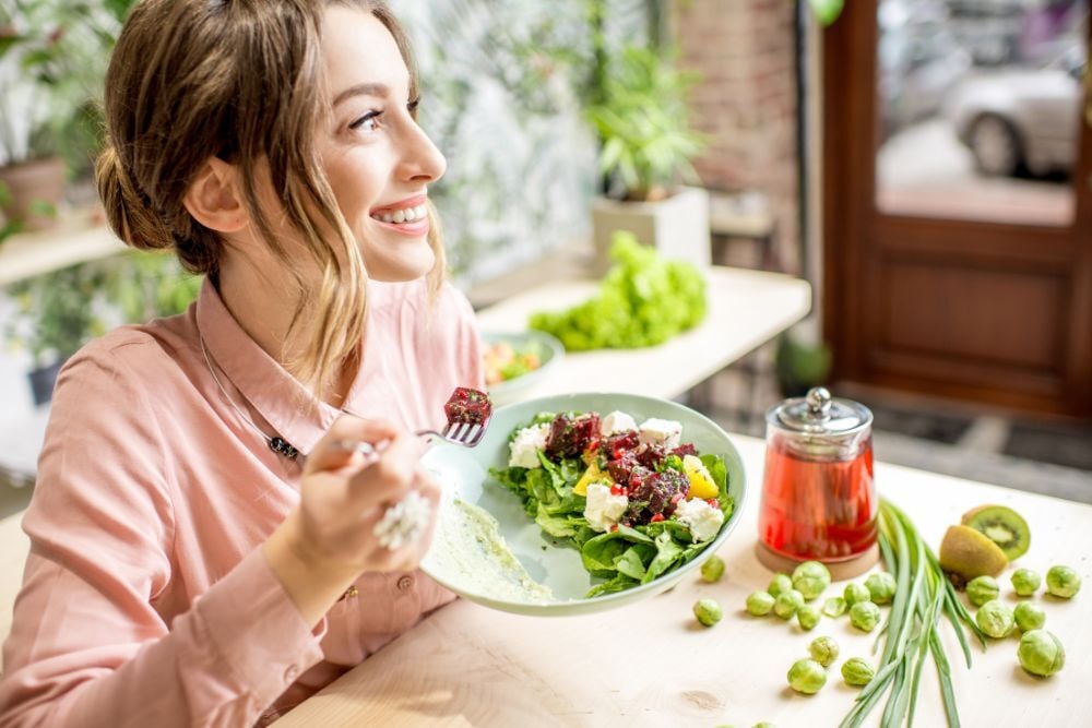 health conscious female eating a salad