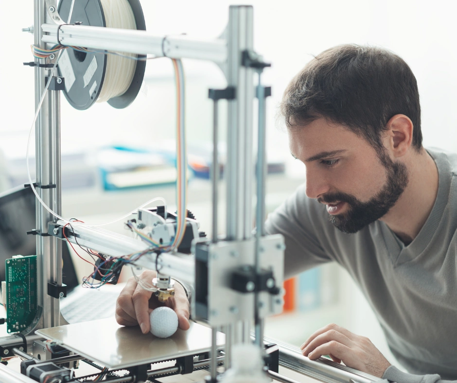Man using a 3D printer