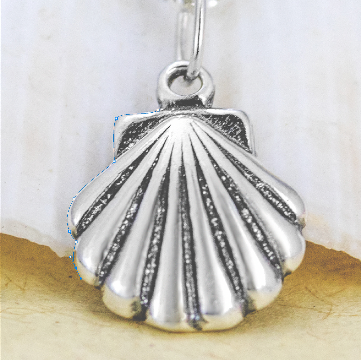 Sterling Silver shell charm with partial pen outline