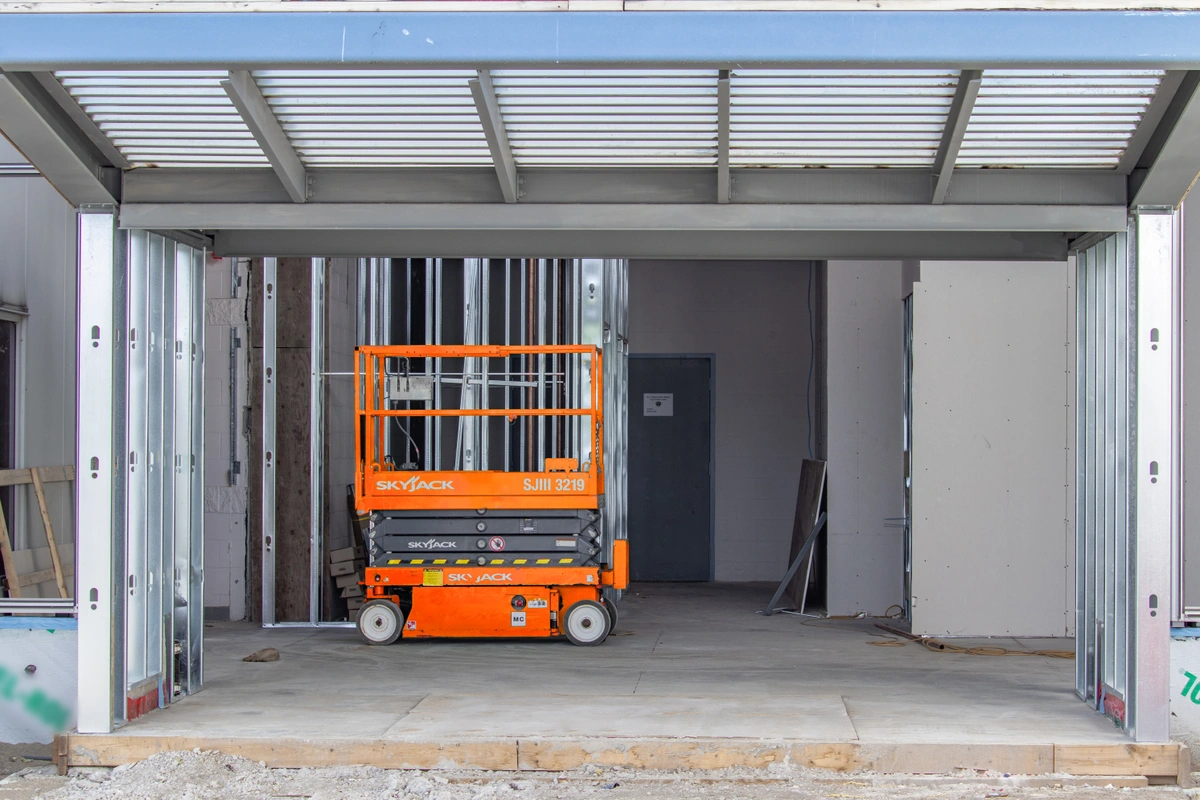 indoor scissor lift operating on concrete floors