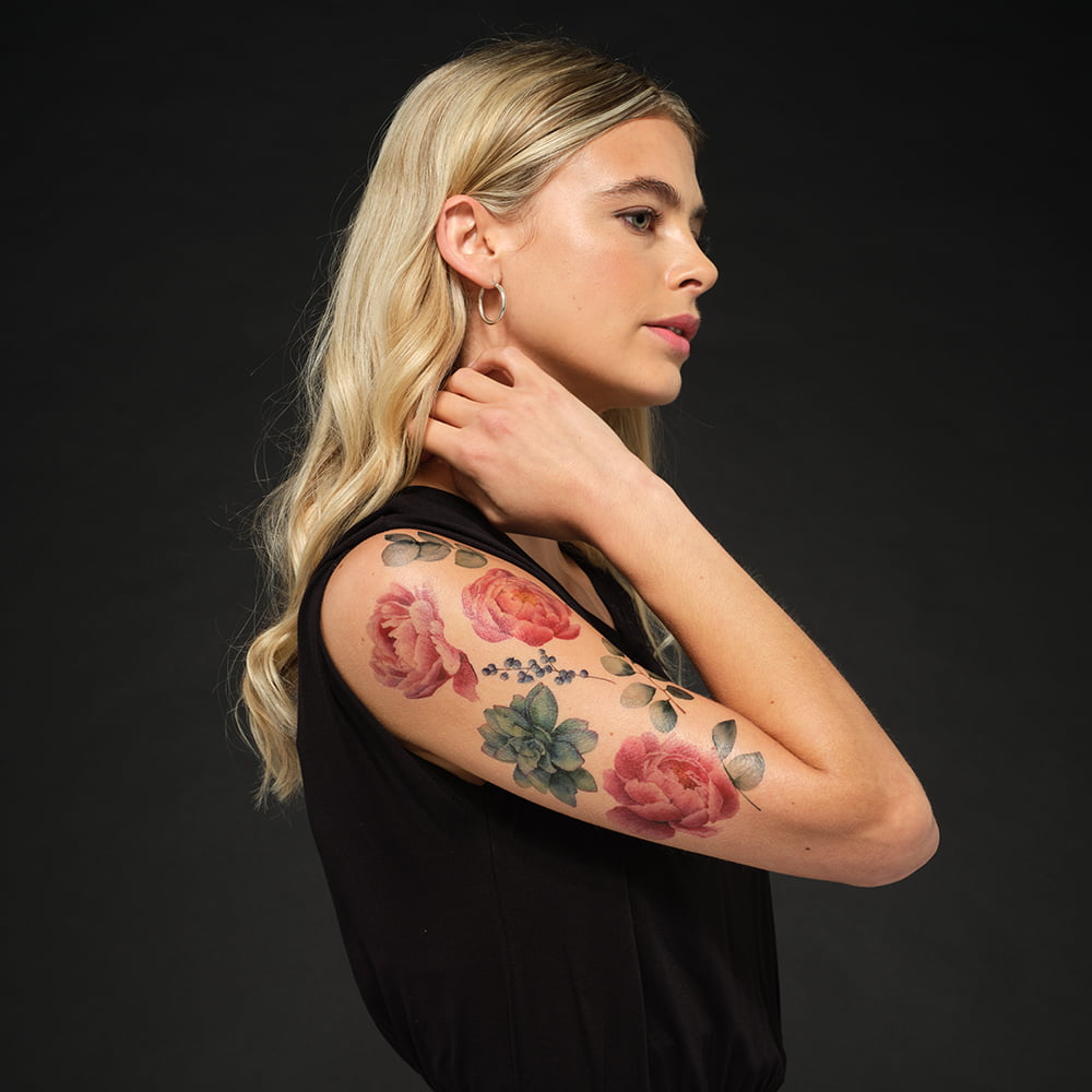 woman with temporary tattoo on arm
