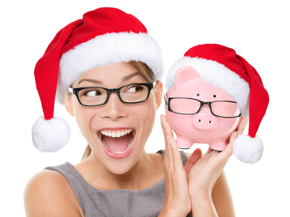 happy woman with piggy bank saving for holidays