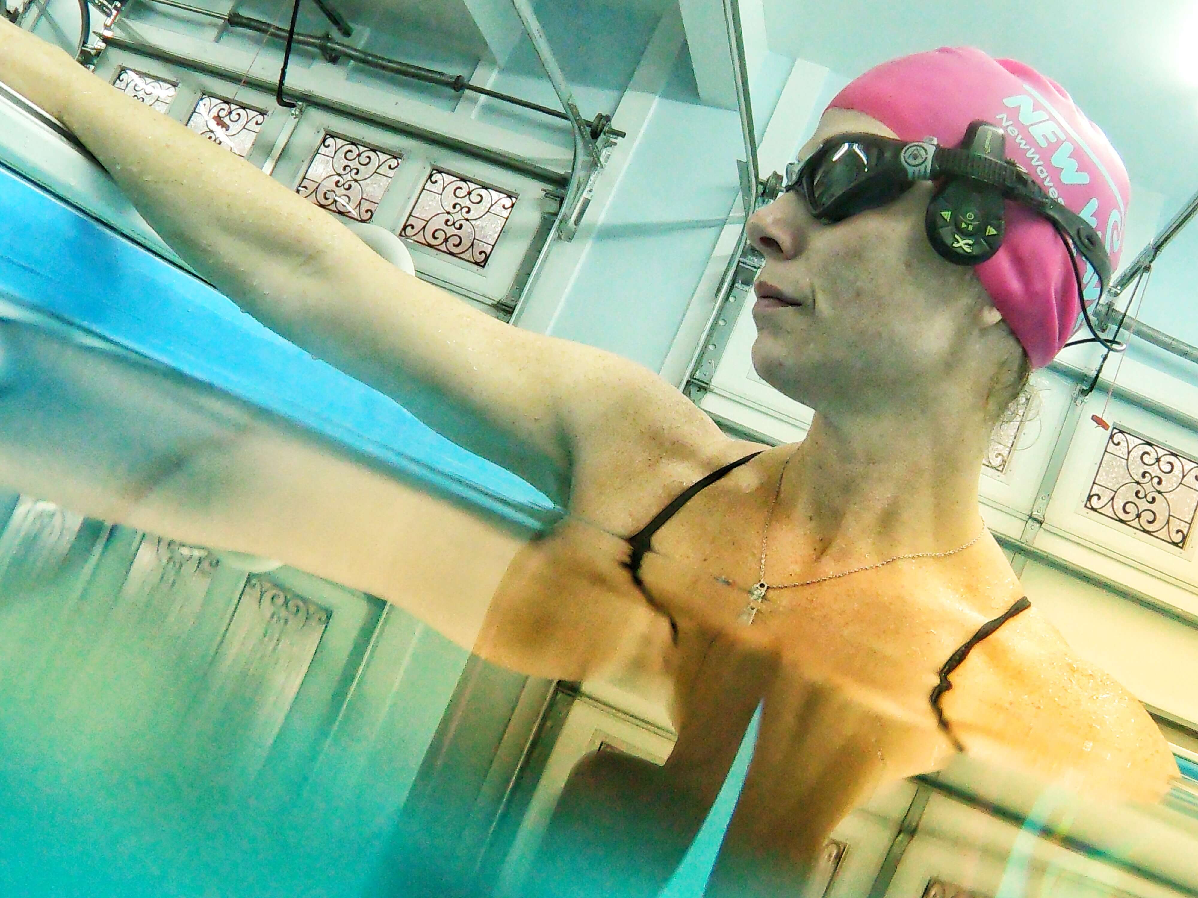 Triathlete, fitness coach, and working mom Melissa in the High Performance Endless Pools swimming machine in her garage