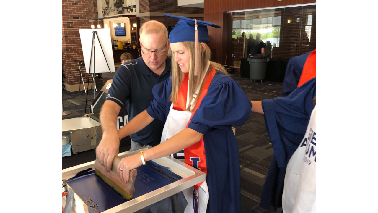 Live screen printing at University of Illinois' 2019 graduation ceremony