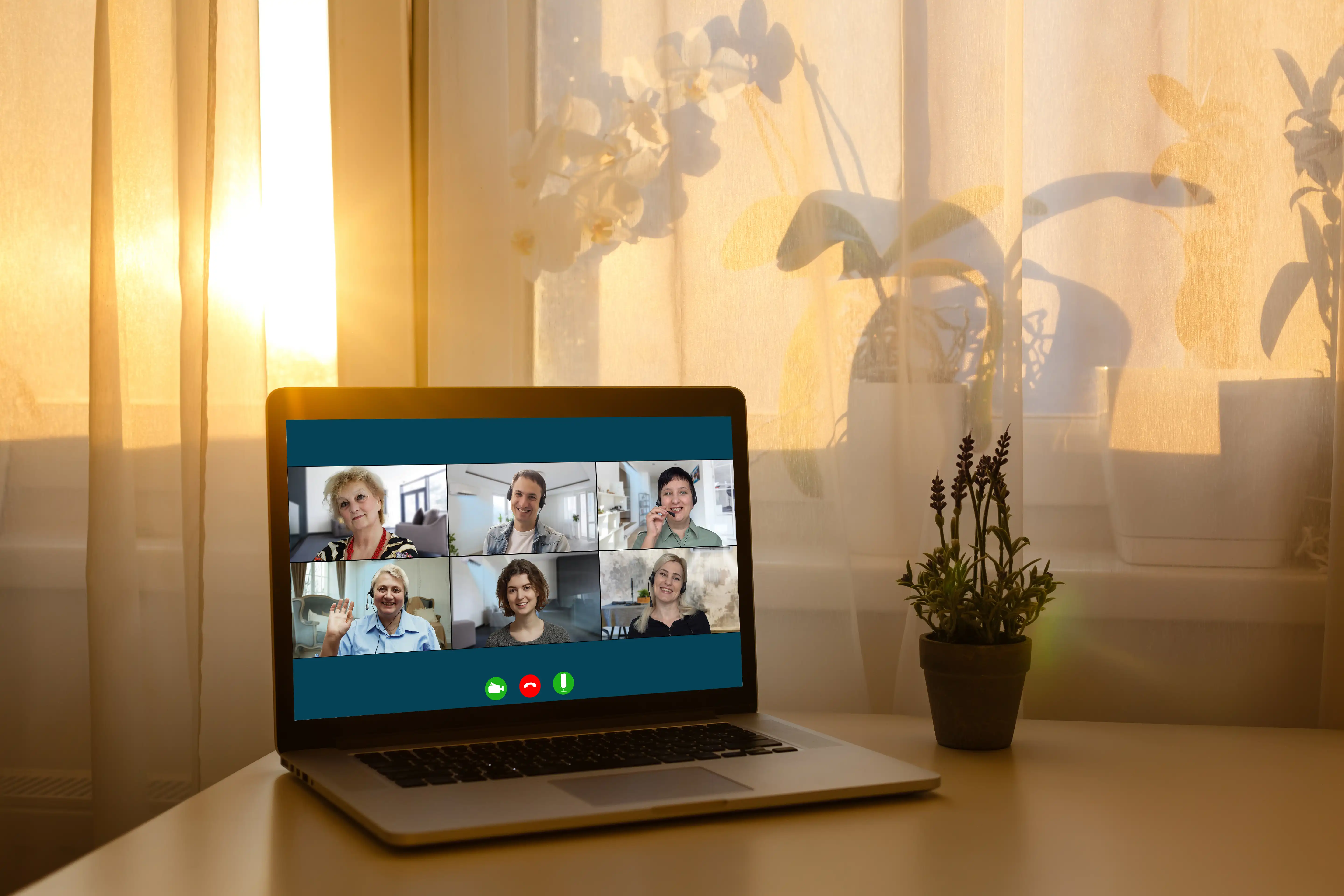 Laptop displaying a remote team video meeting