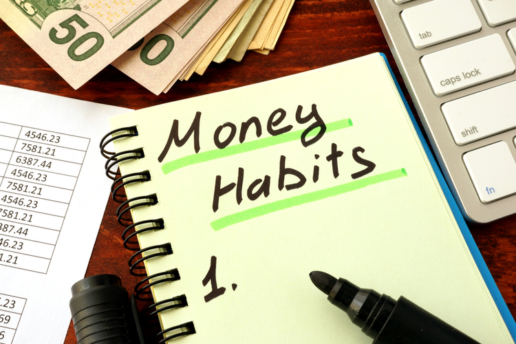 money spending habits spelled in a notebook