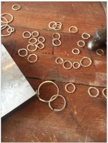 unsoldered silver rings of various sizes for chain making