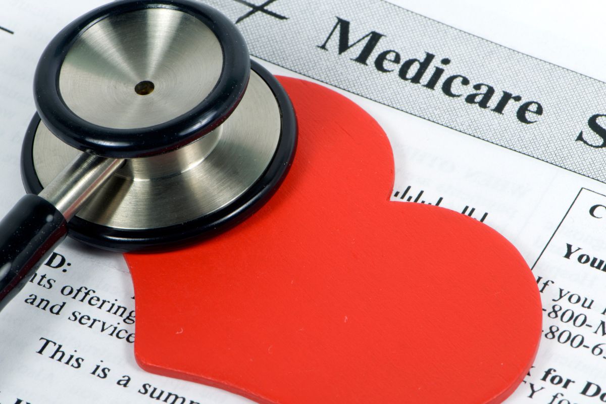 a stethoscope and heart over a medicare application