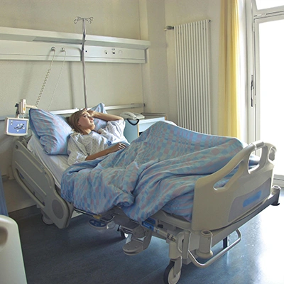 Woman in hospital bed