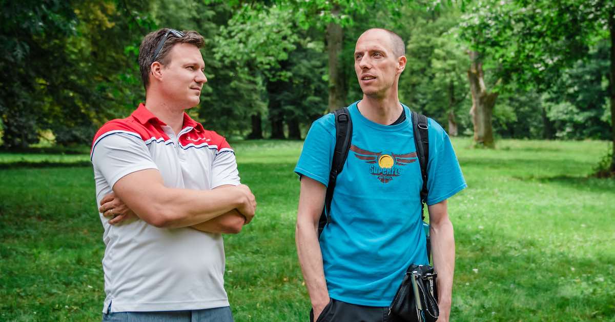 Two men talking outdoors 